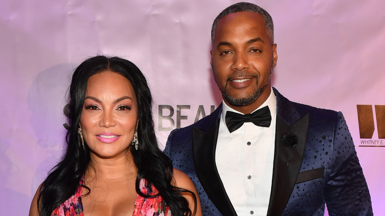Egypt Sherrod and Mike Jackson pose in 2022