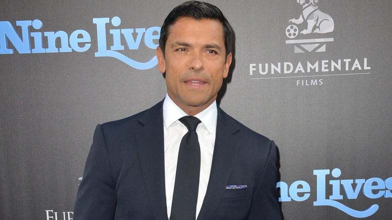 Mark Consuelos wearing a suit on red carpet at a film event